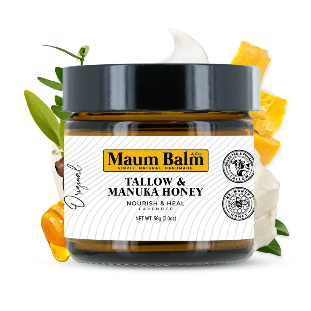 Maum Balm Tallow & Manuka Honey Balm in amber glass jar with black lid, surrounded by natural ingredients like honey, tallow, and botanical extracts.