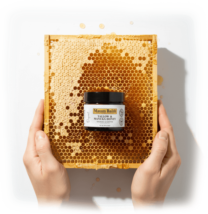 Maum Balm on Honey Comb with woman holding honey comb.